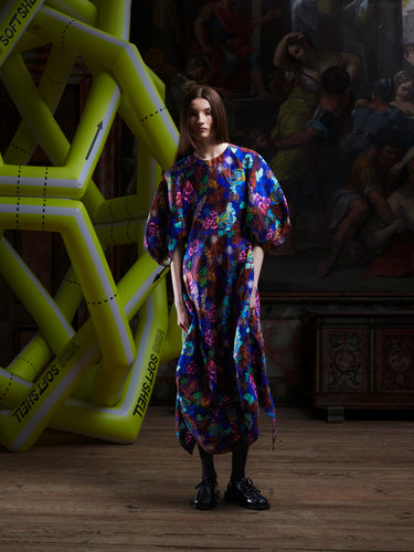 Model wearing the Double Bass Dress in Space Chickens, front view. Model is 185 cm and wears size S, showing the round neck, wide sleeves, and fitted hourglass silhouette.