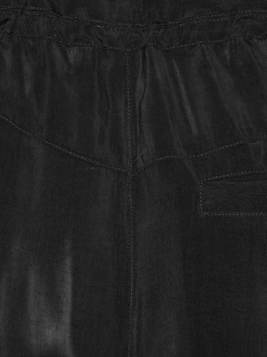 Close-up of the Drawstring Pants in Black, highlighting the smooth black fabric, elastic waistband, and drawstring detail.