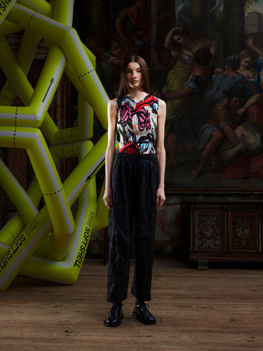 Female model wearing the Drawstring Pants in Black Amulets, front view. Model is 185 cm and wears size S, showing the relaxed straight fit, side pockets, and drawstring waistband.