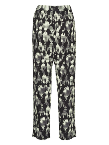 Back view of full plissé pants with the black, grey, and white bursting-eggs pattern.