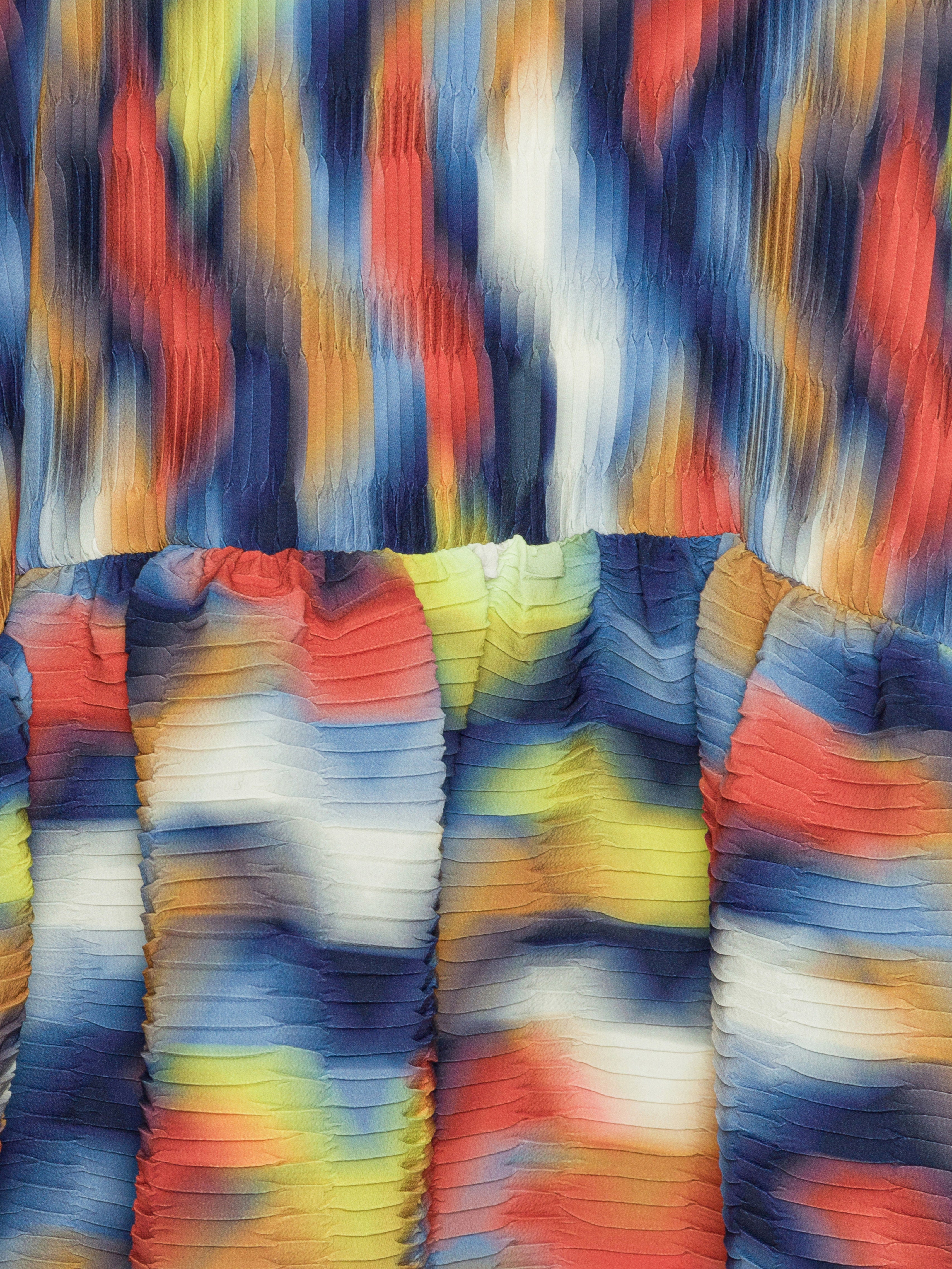 Multicolored pleated fabric with an abstract pattern