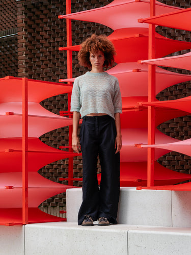 Model wearing the Hug Knit Tee in Multi Hug mint cropped knit tee with round neck, collar detail and elbow length sleeves, front view – Henrik Vibskov Spring/Summer 2026 Key Collection