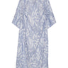 Front view of the Insurance Dress in light blue with white textured floral pattern, V-neck, short wide sleeves, and loose silhouette.