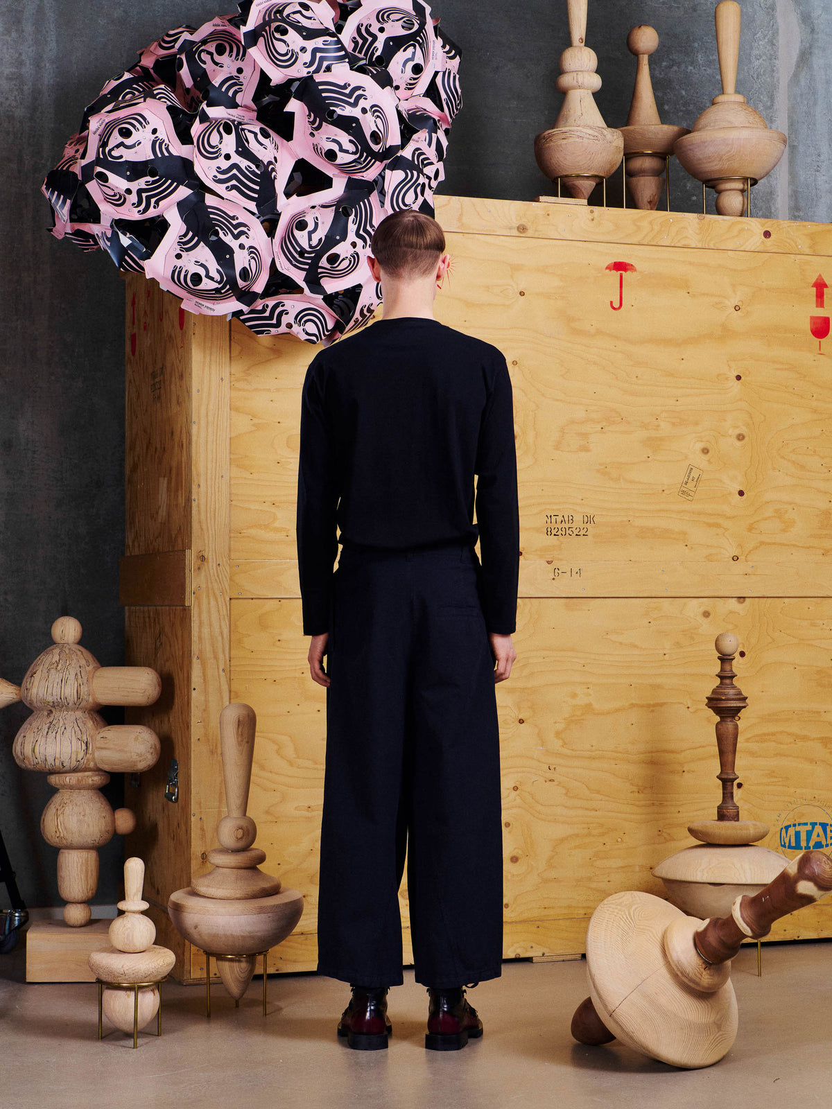 Henrik Vibskov Johnny Jeans in Black styled on model from the back, showing cropped wide leg and back welt pocket detail. ID: ARCHIVE-M503