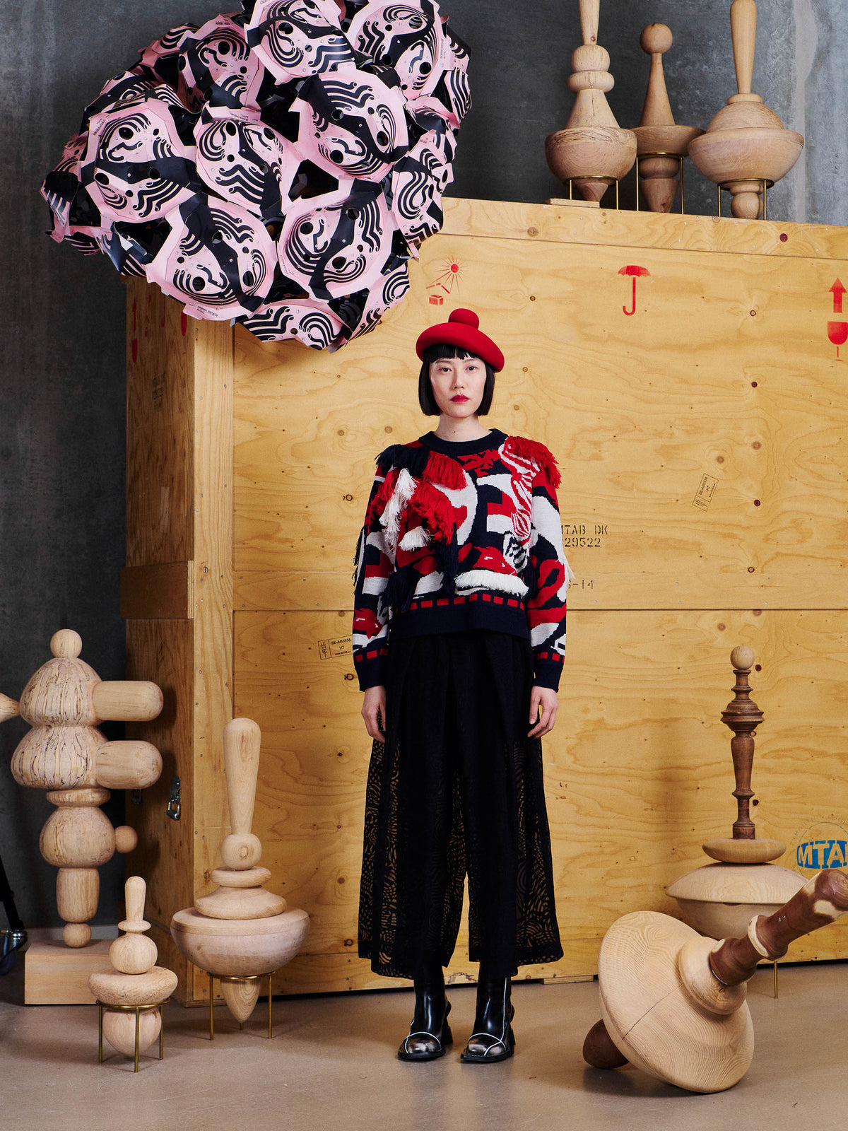Model wearing Henrik Vibskov Knit Ham Onion Sweat in Navy Red Onion with cropped fit, round neckline, long sleeves and sculptural fringe detailing