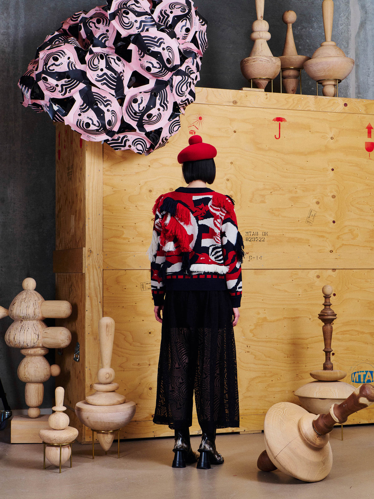 Back view of Henrik Vibskov Knit Ham Onion Sweat in Navy Red Onion showing all-over jacquard pattern, fringe detailing and ribbed hem