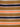 Close-up of fabric with multicolored stripes in brown, orange, black, and silver.