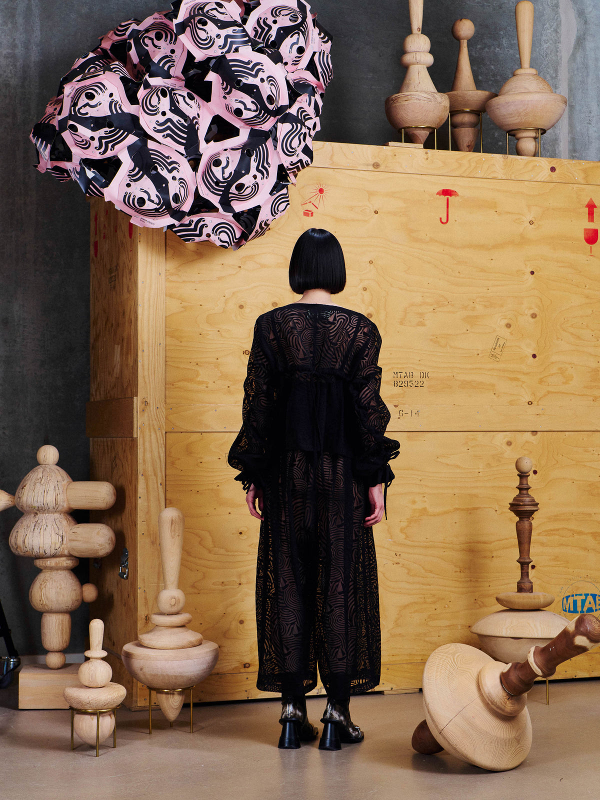 Henrik Vibskov Long Delivery Dress in Dark Stormy Sea styled on model from the back, showing sheer patterned fabric, relaxed fit and layered panel construction. ID: ARCHIVE-F311