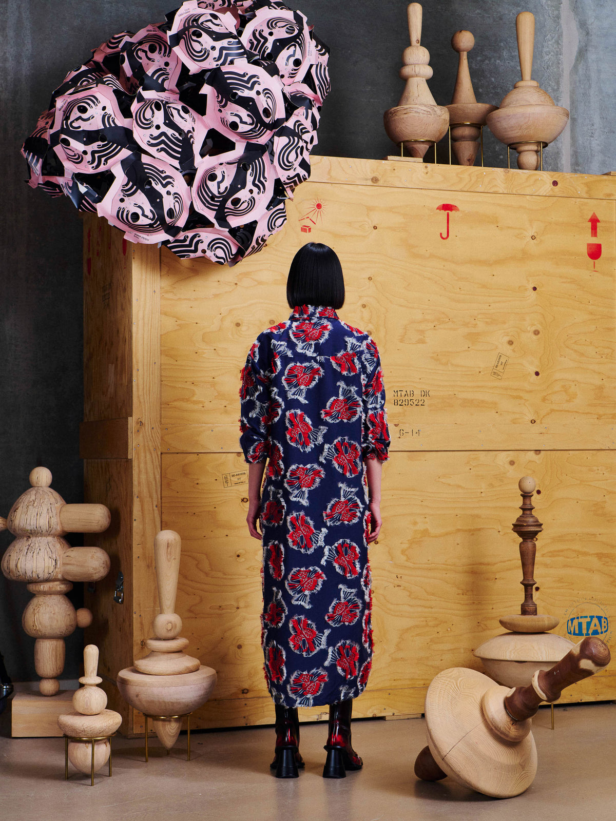 Henrik Vibskov Love You Dress in Red Navy Birdy styled on model from the back, showing the relaxed long shirt dress silhouette and all-over bird motif. ID: ARCHIVE-F302