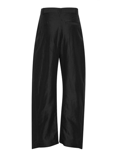 Back view of the Merge Pants showing the wide-leg silhouette and high-low leg construction.