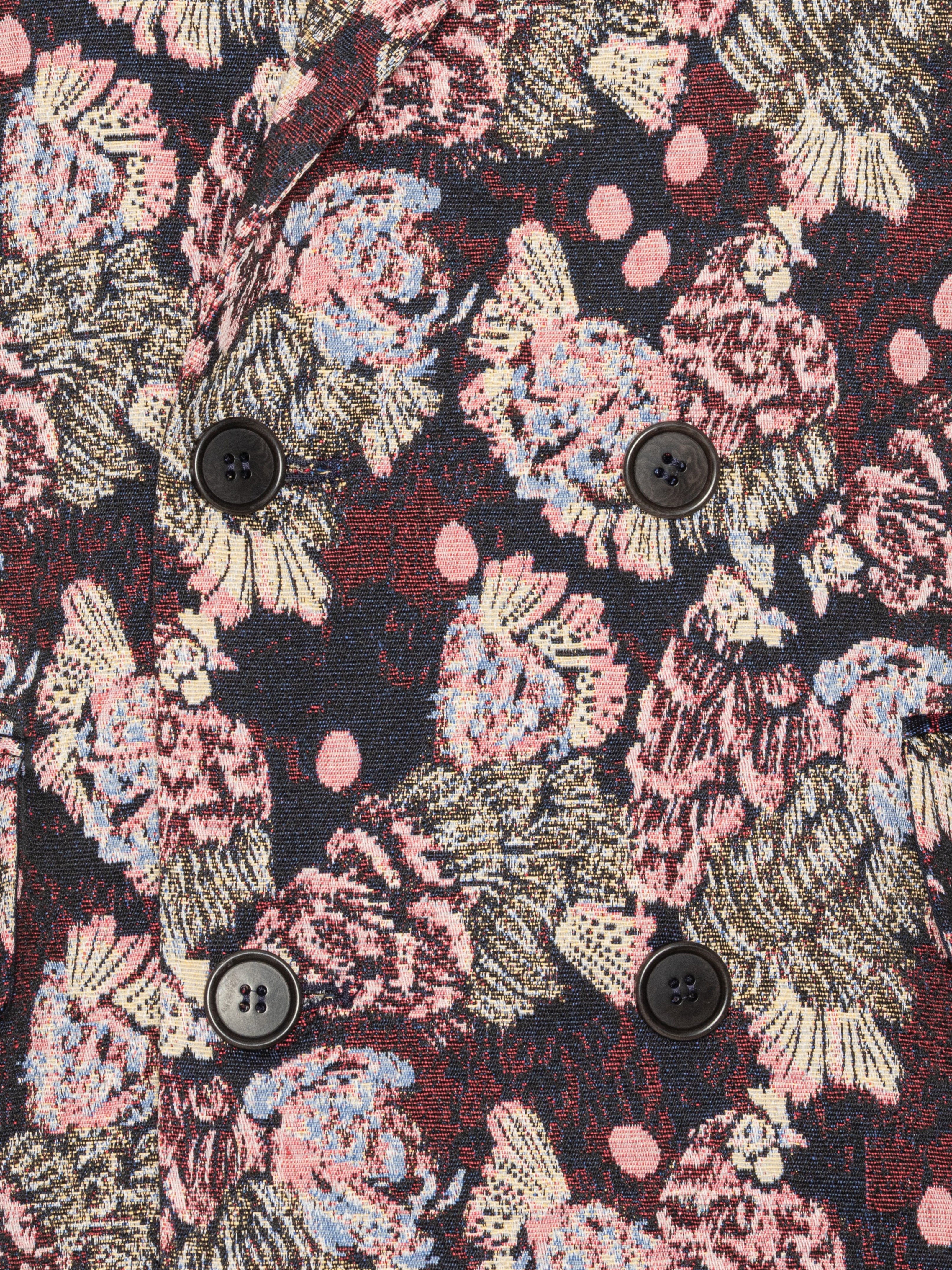 Close-up of the Henrik Vibskov Motif Blazer in Navy Chickens, highlighting the pink and purple abstract chicken embroidery, button details, and textured navy fabric.