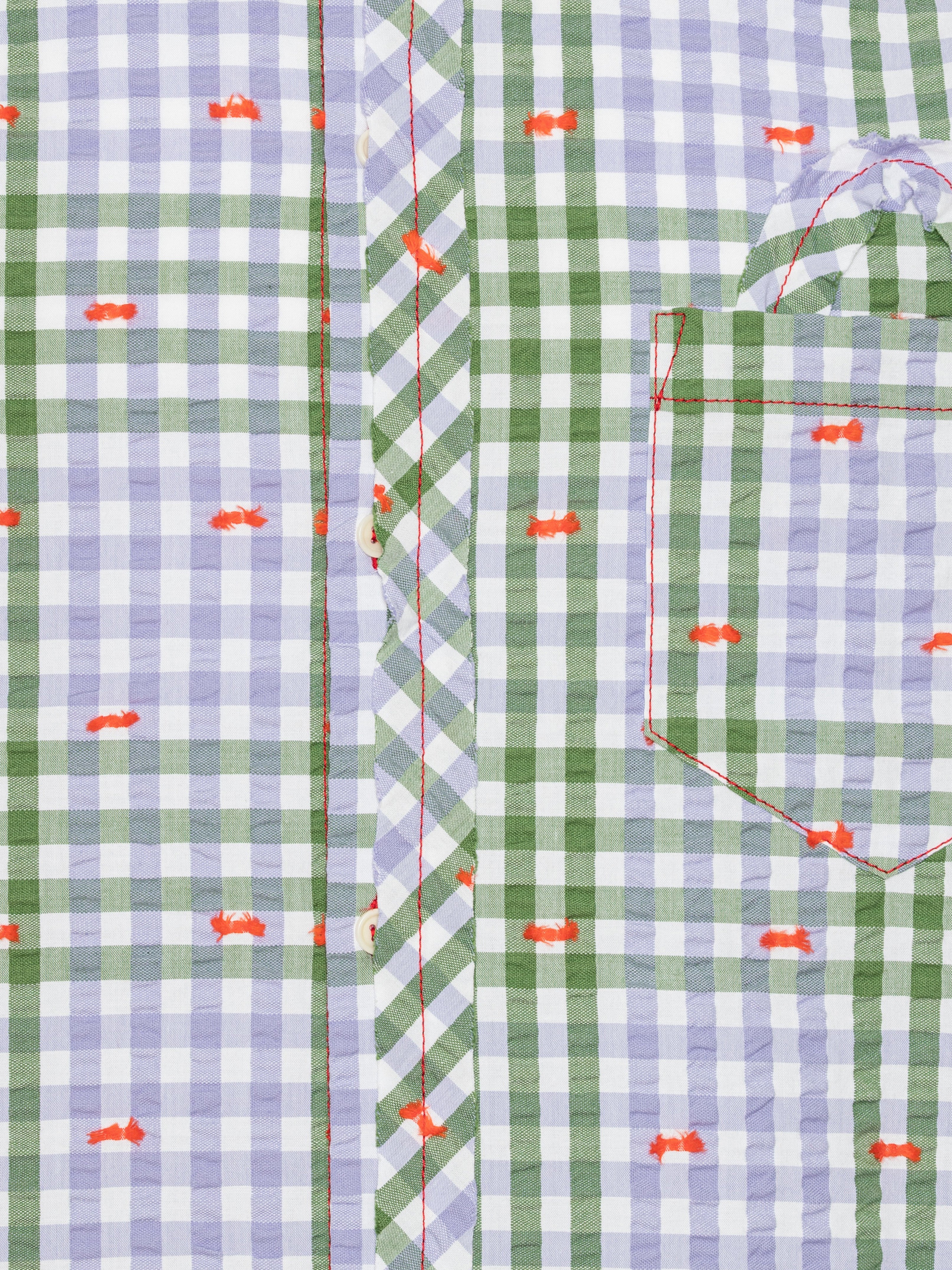 Close-up of the Henrik Vibskov New Blou Shirt in Checks Fillé, highlighting the purple and green checks, orange contrast stitching, and button details.