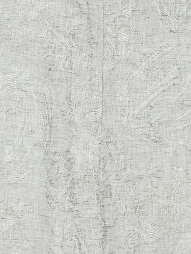 Close-up of the grey textured floral material, showing belt loops and detailed fabric texture.