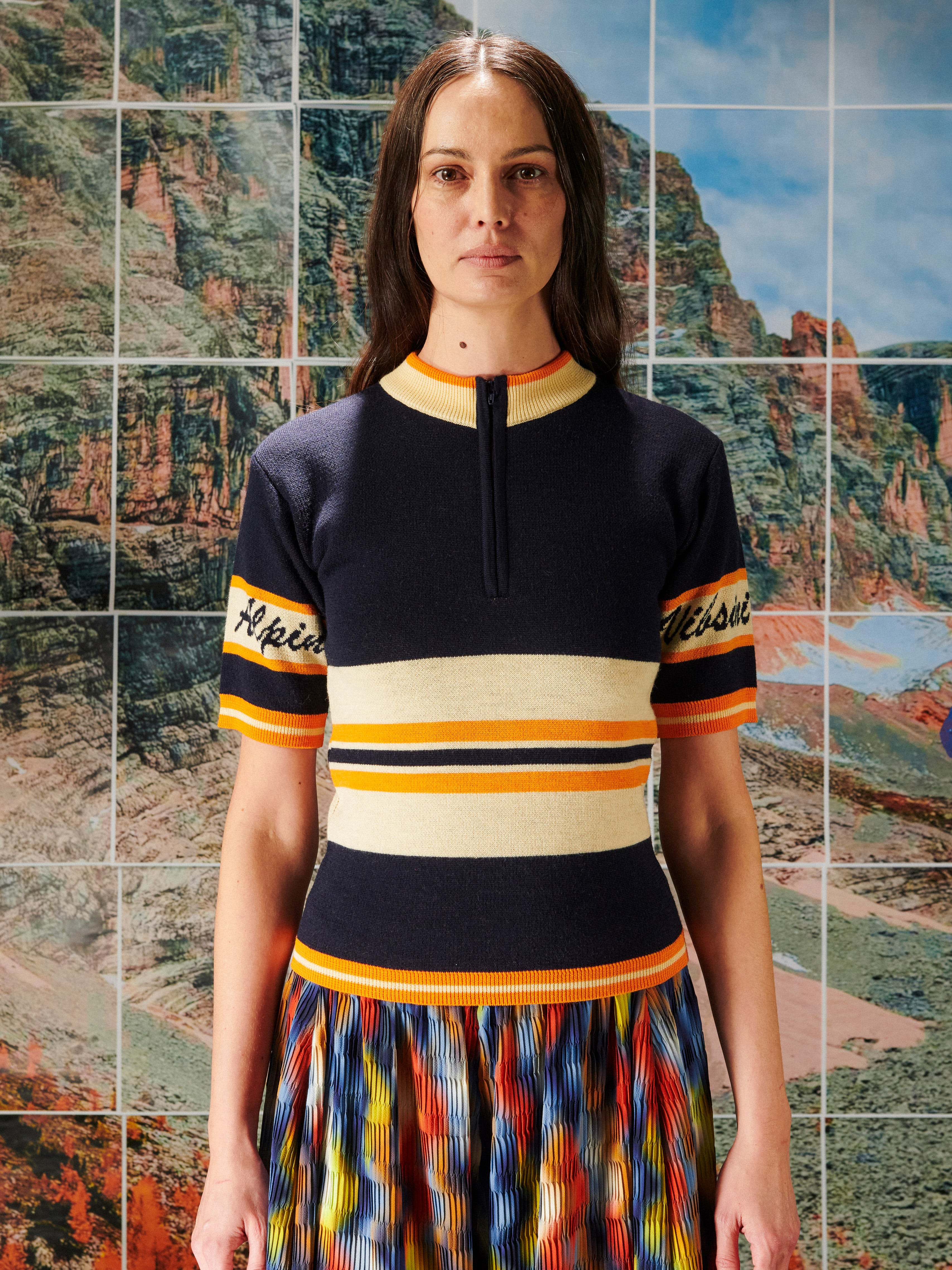 Woman wearing a striped shirt with a scenic background