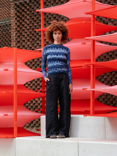 Model wearing the Resonance Longsleeve in Navy Flame blue patterned long sleeve top with snug round neck and form-fitting silhouette, front view – Henrik Vibskov Spring/Summer 2026 Key Collection