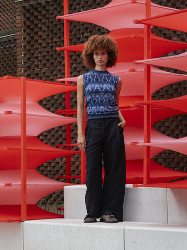 Model wearing the Resonance Top in Navy Flame blue patterned sleeveless top with snug round neck and form-fitting silhouette, front view – Henrik Vibskov Spring/Summer 2026 Key Collection