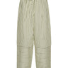 Front view of the Shants Pants in green and off-white stripes with subtle text, showing elastic waistband, drawstring, and wide legs with layered detailing.