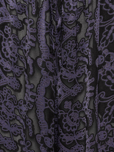 Close-up of the Victorian Burnout fabric showing the semi-transparent texture and dark purple layered detailing.