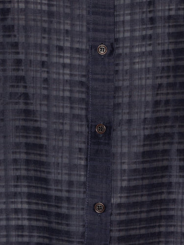 Close-up of a dark blue plaid shirt with button details