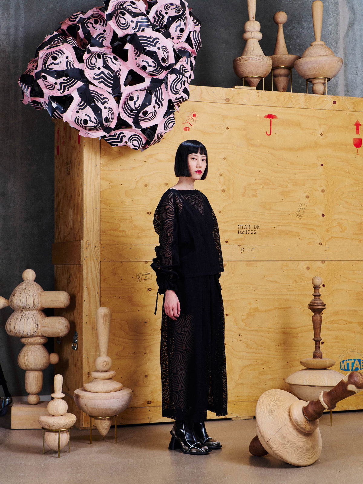 Henrik Vibskov Tommy Pants in Dark Stormy Sea styled on model from the side, showing layered panels, pleated shape and flowing wide leg fit. ID: ARCHIVE-F501