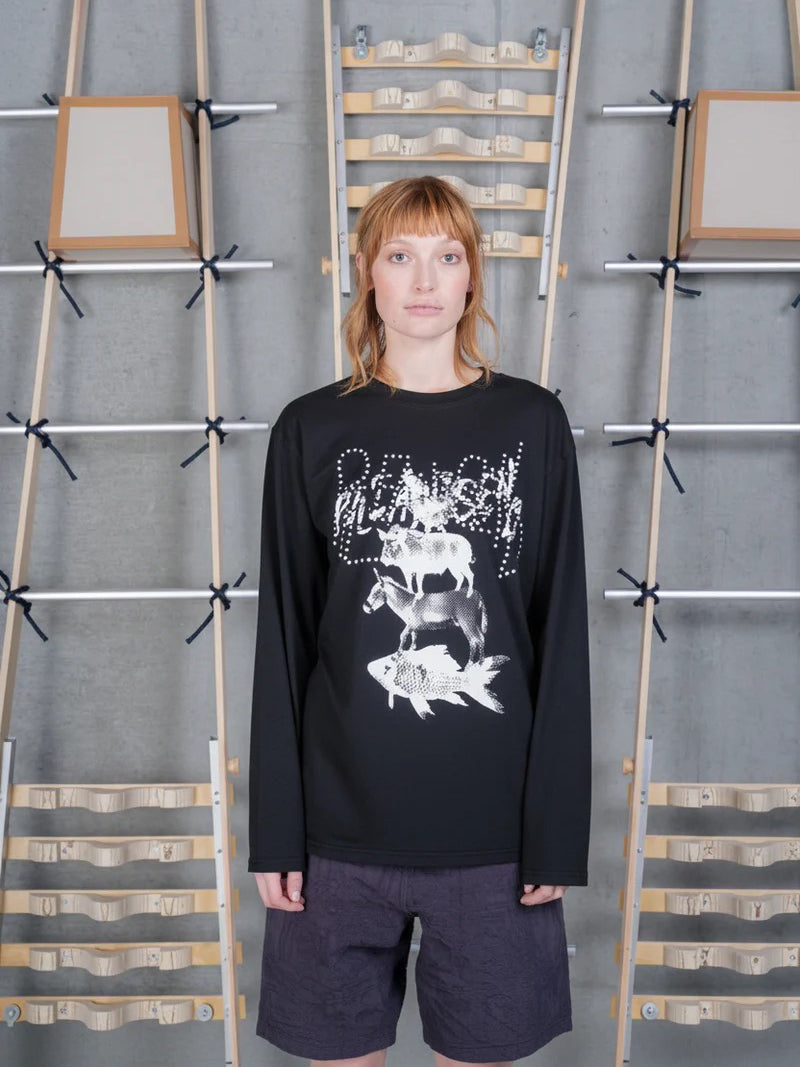 Front view of a female model wearing the Henrik Vibskov Tower Swamp Blouse in Black, highlighting the large off-white graphic print across the front and relaxed silhouette.