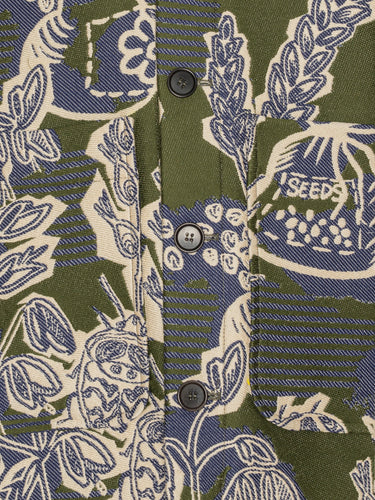 Close-up of green blue and white floral pattern and front patch pockets on the Wheel Jacket in Garden of EEden boxy cotton jacket – Henrik Vibskov Spring/Summer 2026 Key Collection