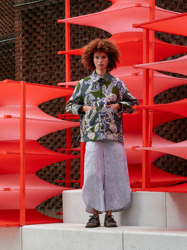 Model wearing the Wheel Jacket in Garden of EEden green blue and white floral boxy jacket with front button closure and patch pockets, front view – Henrik Vibskov Spring/Summer 2026 Key Collection