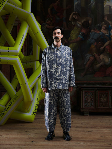 Front view of model wearing the Wheel jacket in a doodle print by Henrik Vibskov