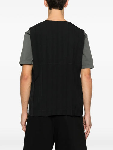 Back view of the black plissé vest with front button closure from Homme Plissé Issey Miyake on a white background.