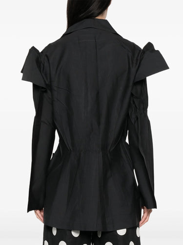 Black jacket from Issey Miyake on a white background