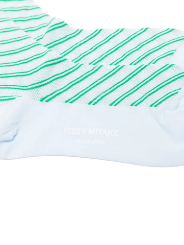 Closeup of the top of Issey Miyake December AW25 Generic Stripes Socks in mint, highlighting ribbed cuff and striped pattern.
