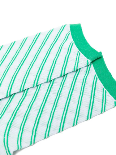 Closeup of the foot section of Issey Miyake December AW25 Generic Stripes Socks in mint, showing striped design and crew-length fit.