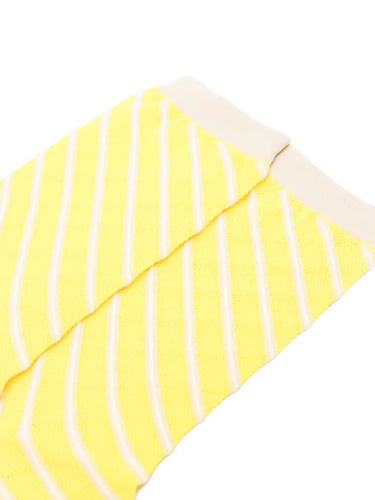 Closeup of the top of Issey Miyake December AW25 Generic Stripes Socks in yellow, highlighting ribbed trim and striped pattern.