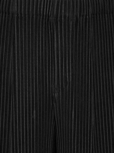Close-up of the black plissé shorts from Issey Miyake Homme Plissé