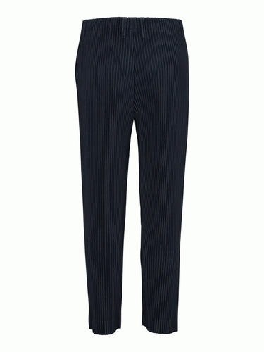 Back view of the navy plissé pants with straight legs from Issey Miyake Homme Plissé
