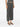 Woman wearing gray pleated pants from Pleats Please Issey Miyake on a white background