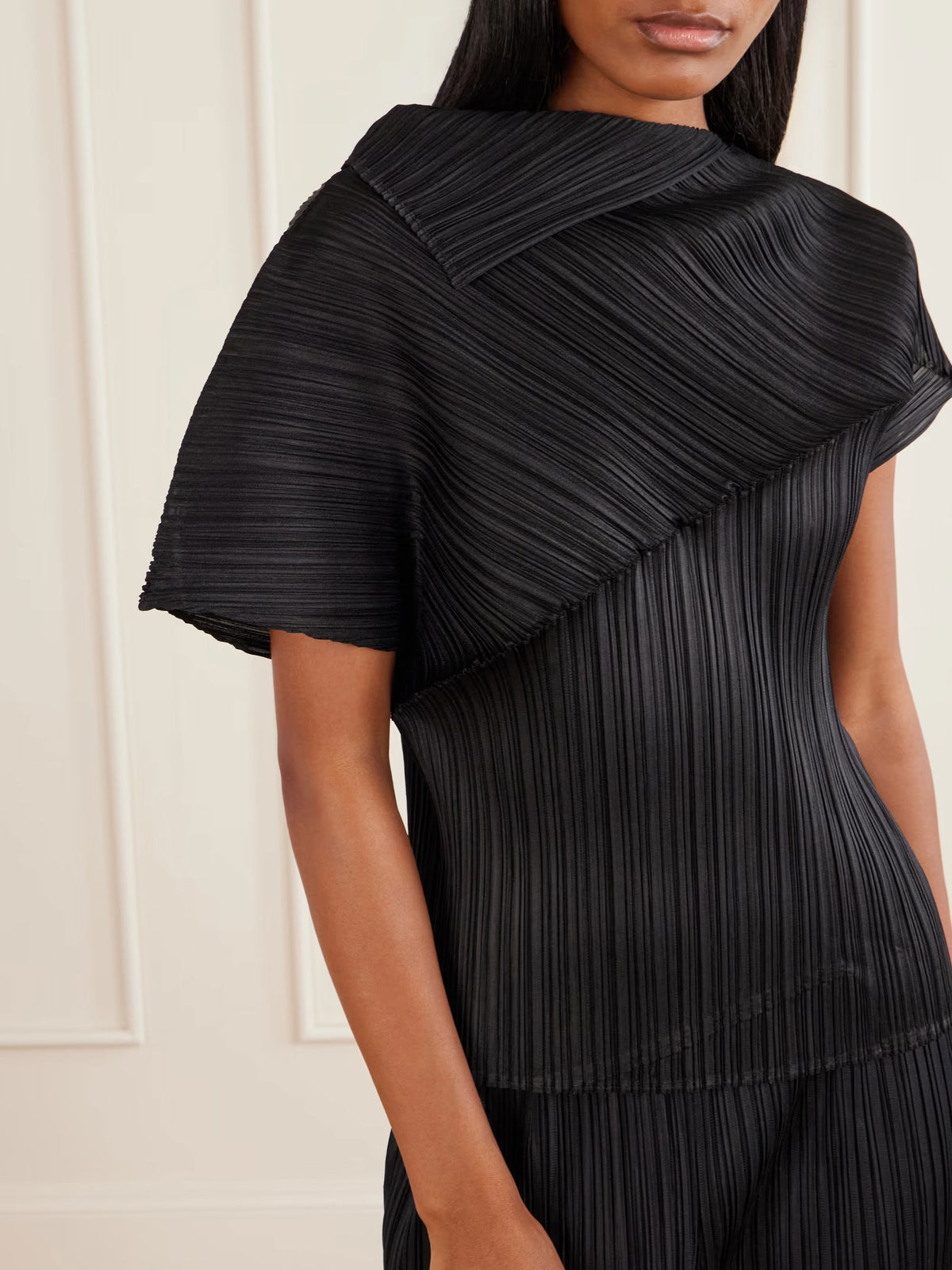 Issey Miyake PLEATS PLEASE October AW26 Leap Shirt in Black, worn angled view showing sculptural neckline