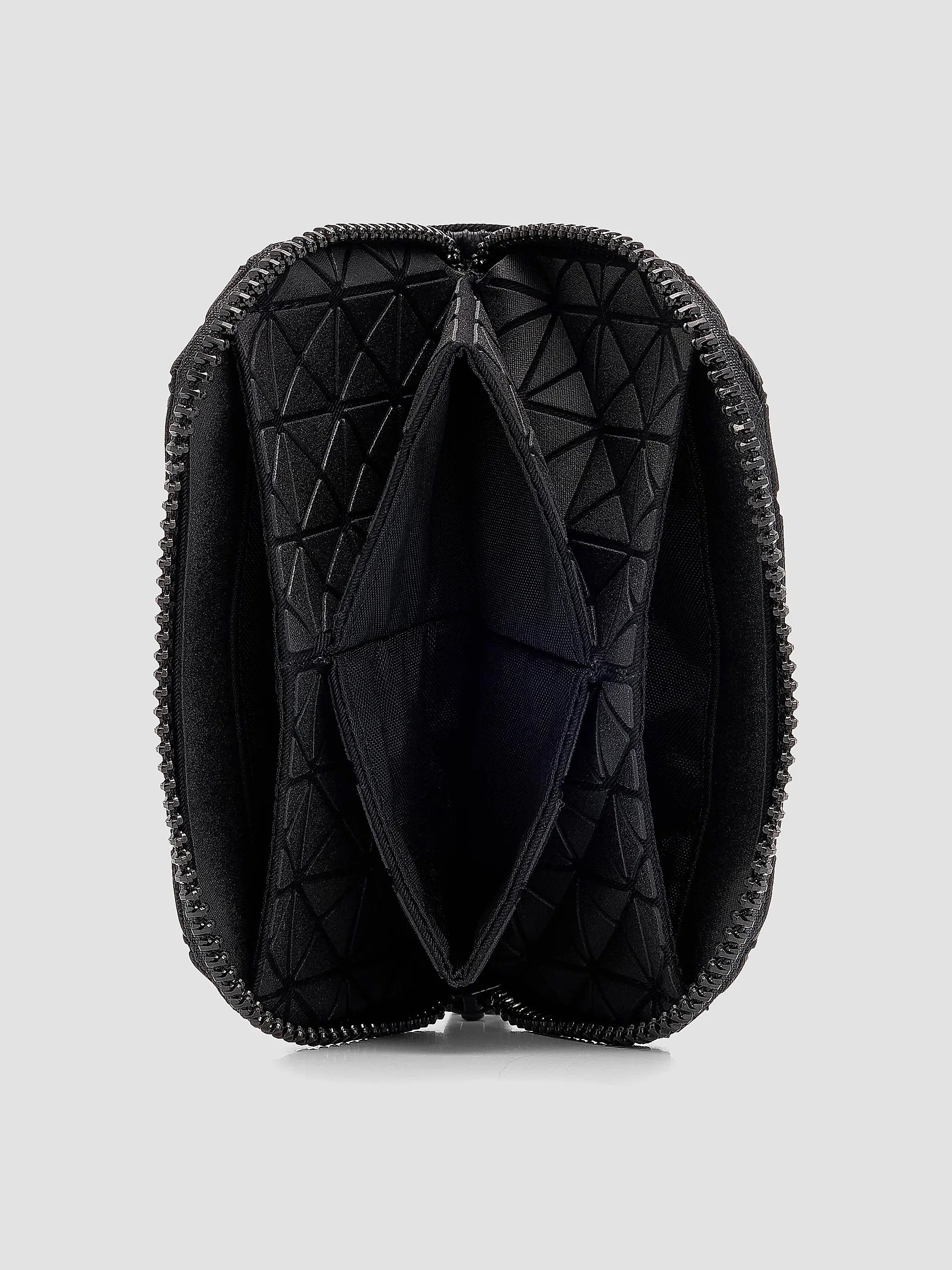 Interior view of Bao Bao Issey Miyake Kuro Fragment Wallet in matte black showing zip opening, nylon lining and internal card slots