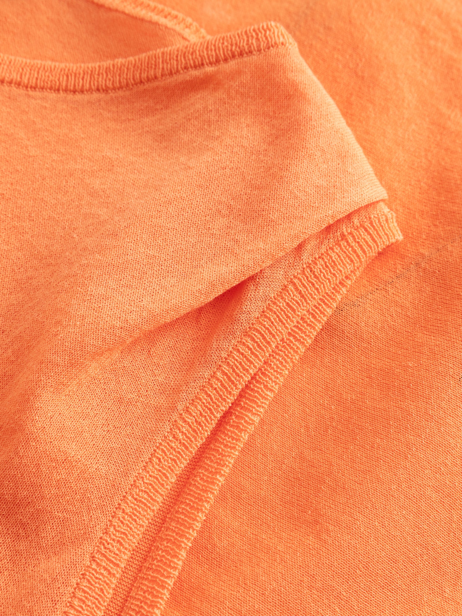 Kiko Kostadinov Kreiner Knit Top in salmon, close-up of structured shoulder tab and ribbed crew neck detail