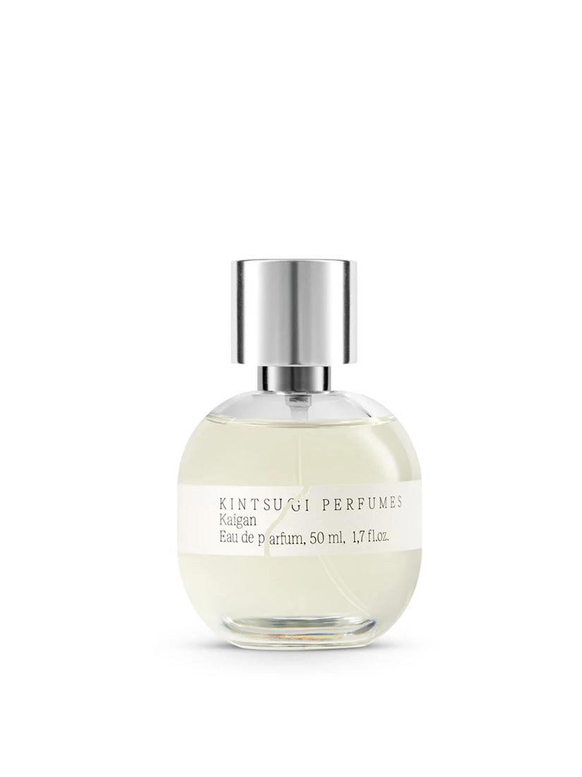 Perfume bottle with silver cap on a white background
