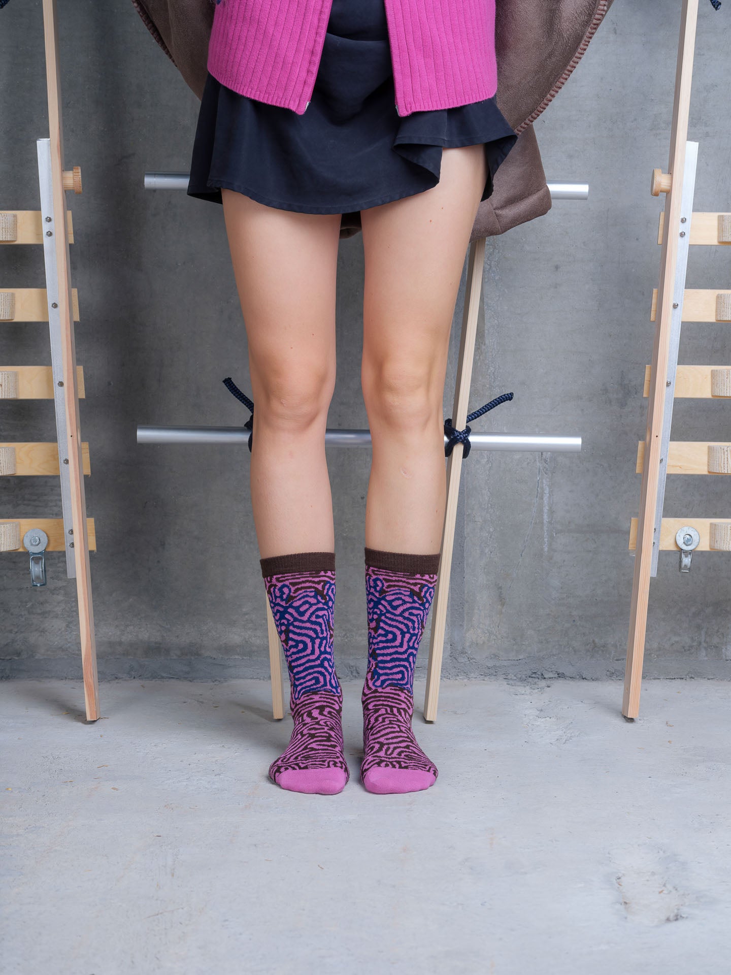 Model wearing Labyrinth Sock in Purple Black Maze by Henrik Vibskov
