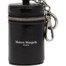 Front view of the Maison Margiela Dog Waste Bag Dispenser in black leather, featuring the white printed brand logo on the front.