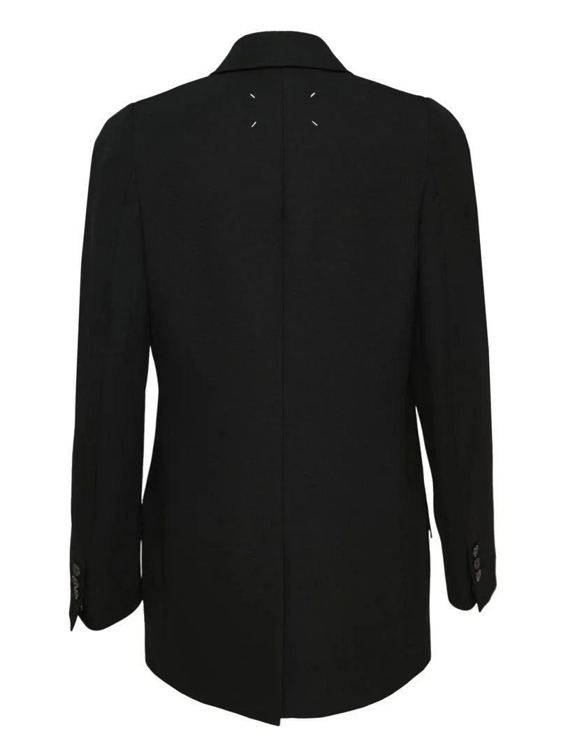 Back view of Maison Margiela Double Breasted Blazer in Black showing the longline relaxed silhouette and signature four stitches at the upper back