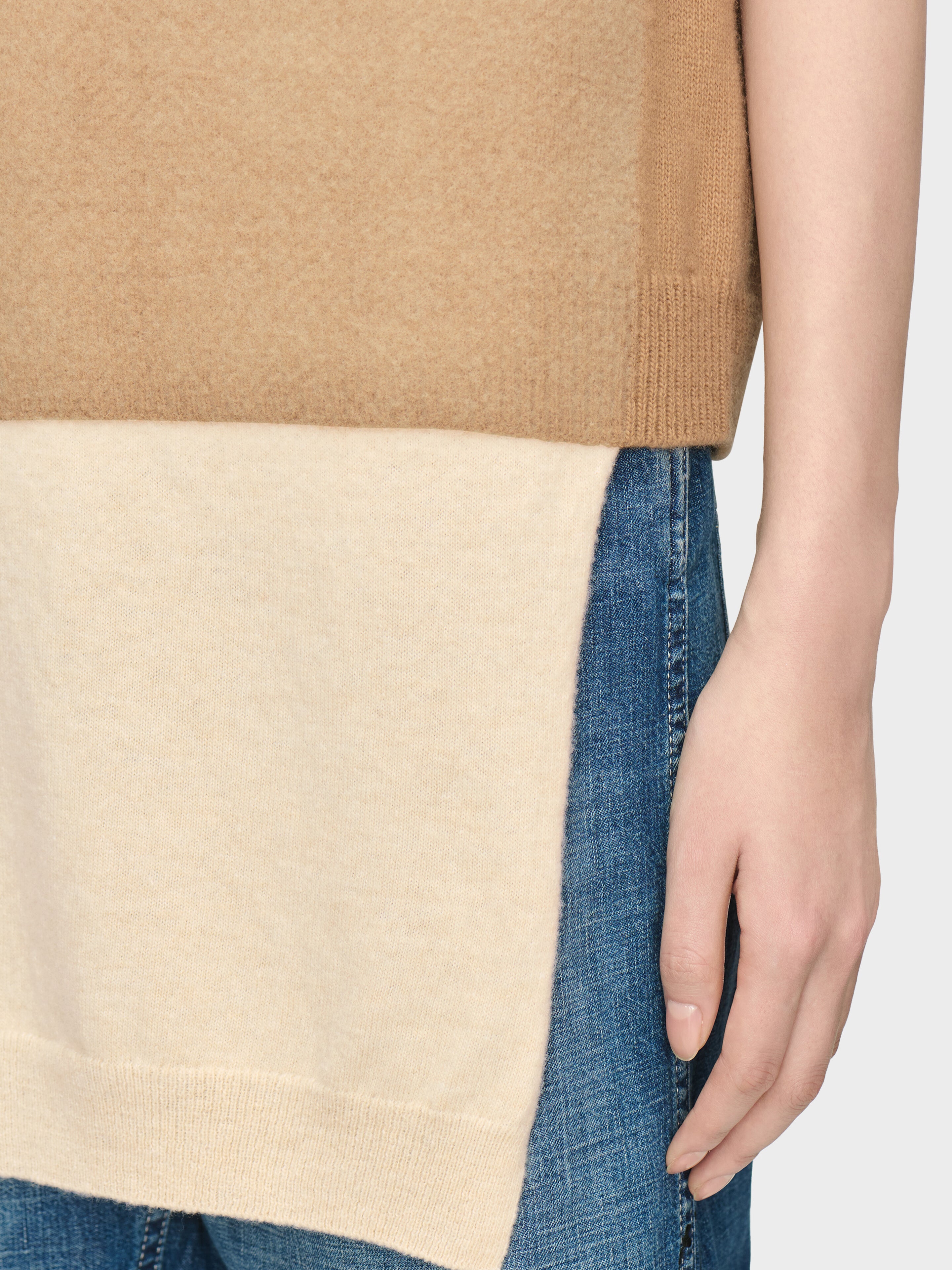 Close-up of Maison Margiela Fuse Knit Top in camel and ecru showing layered lower panel and soft virgin wool texture