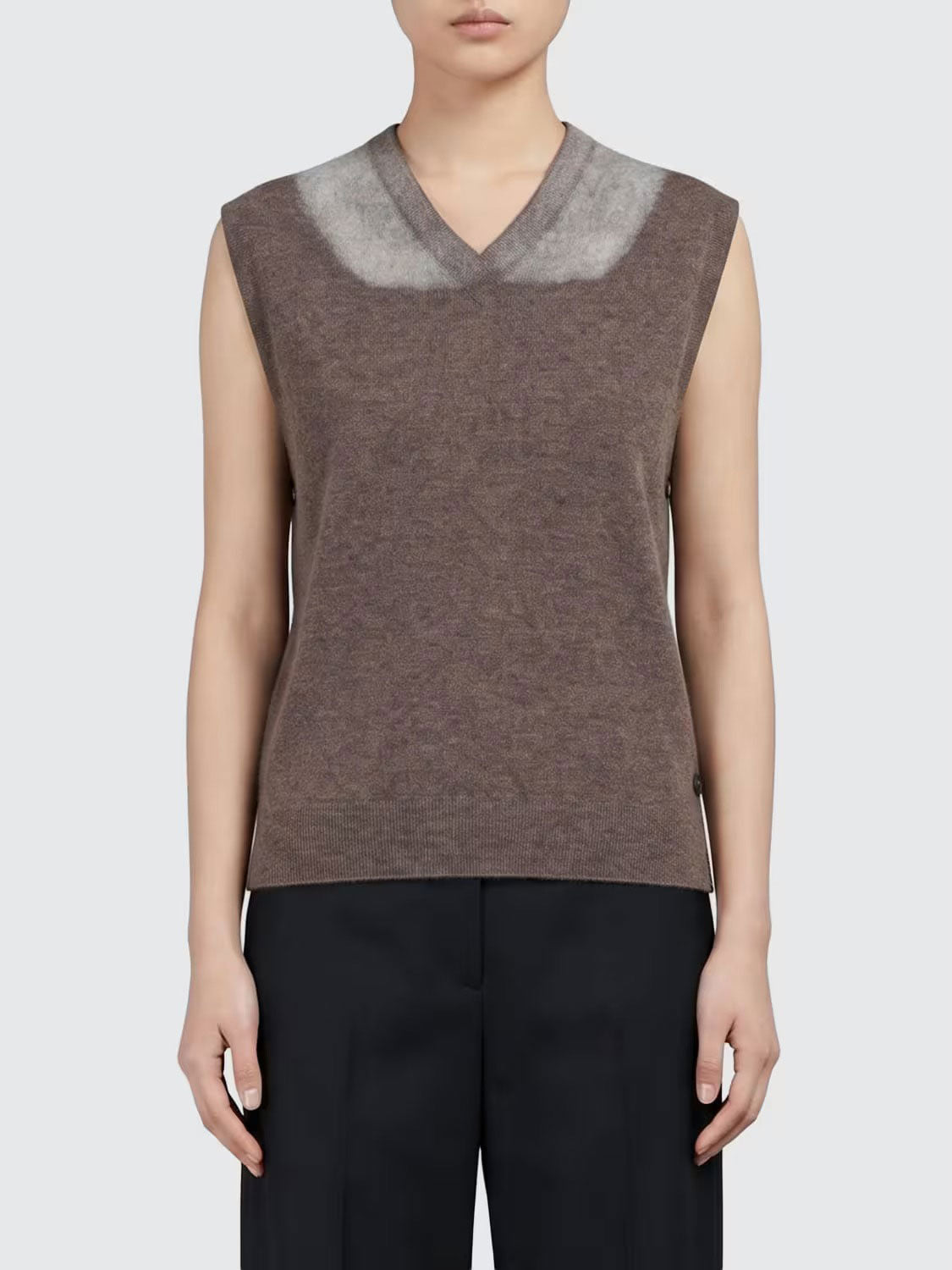 Model wearing the Maison Margiela Fused Knit Stole in Mud Ecru from the front, showing the straight fit, V-neckline and ribbed hem.