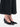 Maison Margiela Heel-Less Pump 55mm worn with a black midi skirt, styled on model to show low wedge height and elegant pointed silhouette