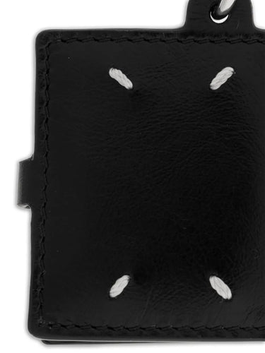 Detail close-up of the ID Photo Holder featuring a clean exterior design with the brand’s four white signature stitches.