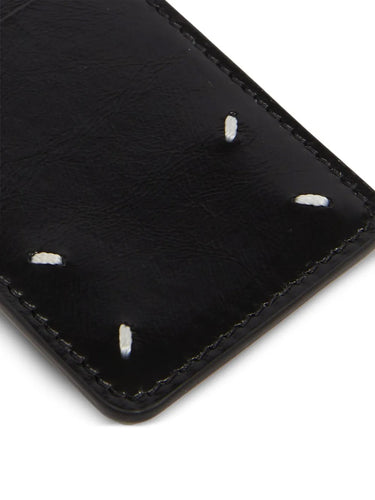 Close-up of the Maison Margiela Keyring Card highlighting the four white signature stitches on black leather.