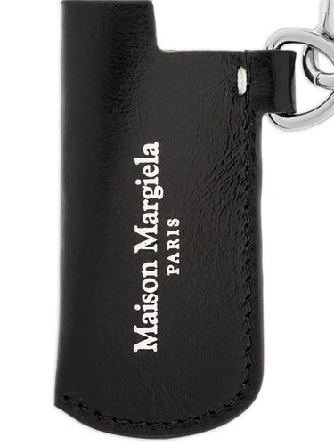 Close-up of the Small Lighter Case highlighting the white printed Maison Margiela logo on black leather.