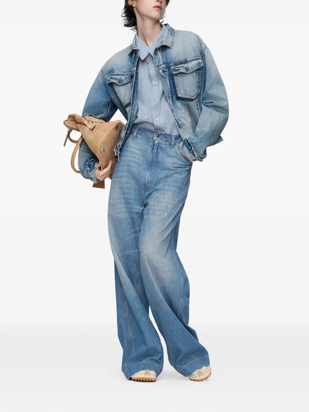 Front view of model wearing the long-sleeved shirt in light blue and grey from Maison Margiela